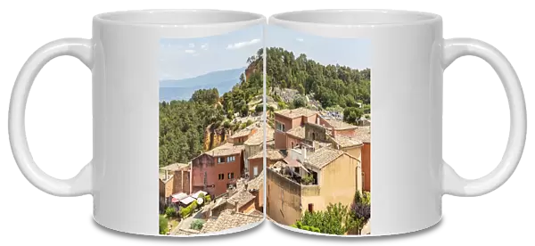 Village houses and the entrance of the Ochre trail in the background, Roussillon