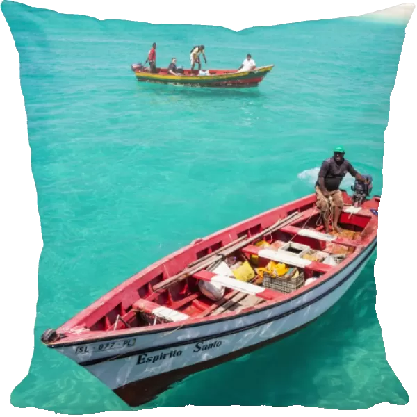 Fishermen bringing their catch of fish in fishing boats to Santa Maria, Sal Island