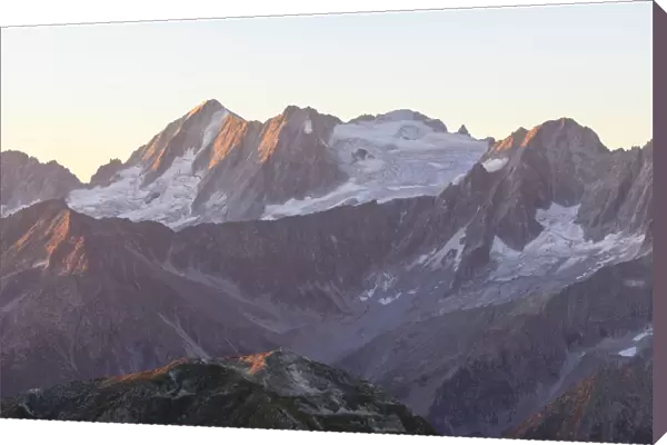 Rocky peak of Cima Presanella seen from Monte Tonale at dawn, Valcamonica, border Lombardy
