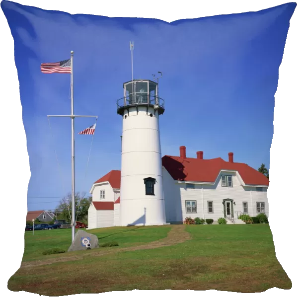 485-2813. The American flag flying beside the Chatham lighthouse at Cape Cod