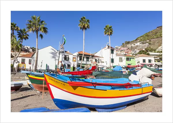 Traditional colourful fishing boats on the beach in Camara de Lobos fishing village