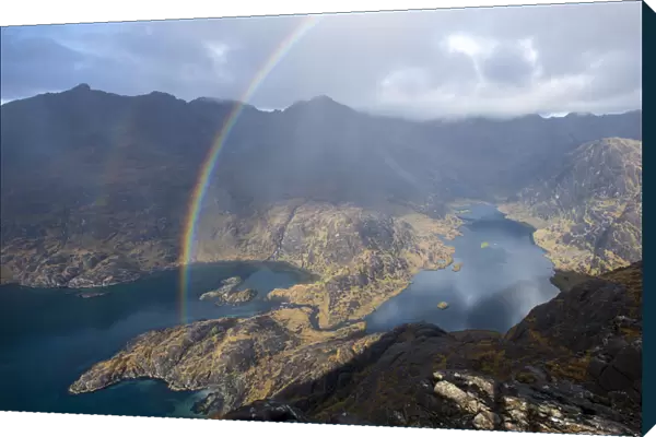 A rainbow above Loch Coruisk and the main Cuillin ridge seen from the top of Sgurr