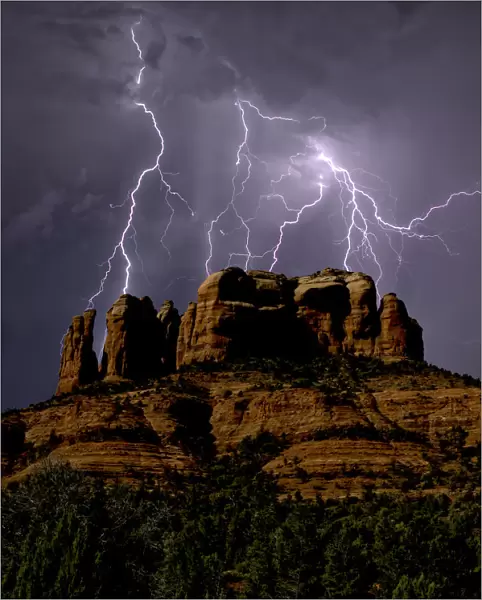 Composite photo of lightning striking southwest of Cathedral Rock in Sedona, Arizona