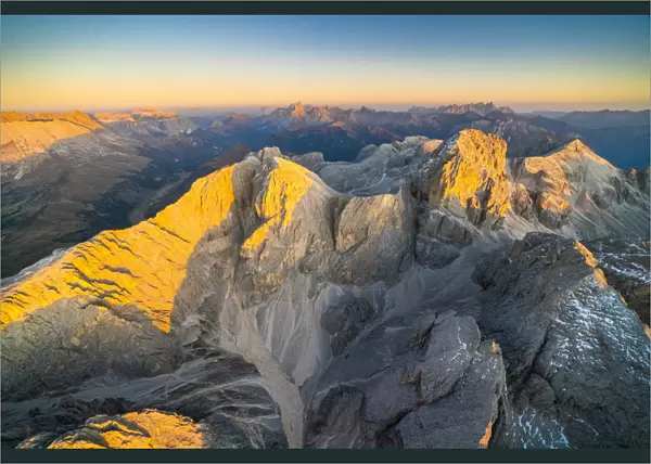 Aerial view of autumn sunset over the majestic peaks of Catinaccio Group, Dolomites
