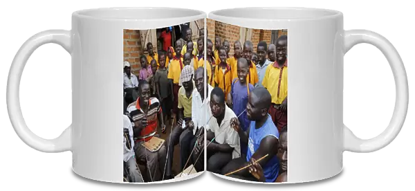 Ugandan villagers drinking home-brewed beer and schoolchildren, Bweyale, Uganda, Africa
