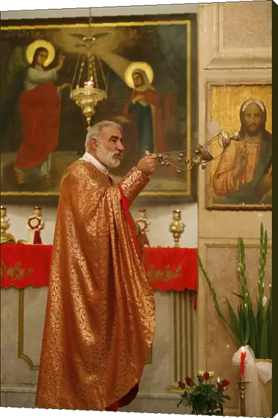 Melkite priest, Emile Shoufani, celebrating Mass in Nazareth, Nazareth, Galilee, Israel