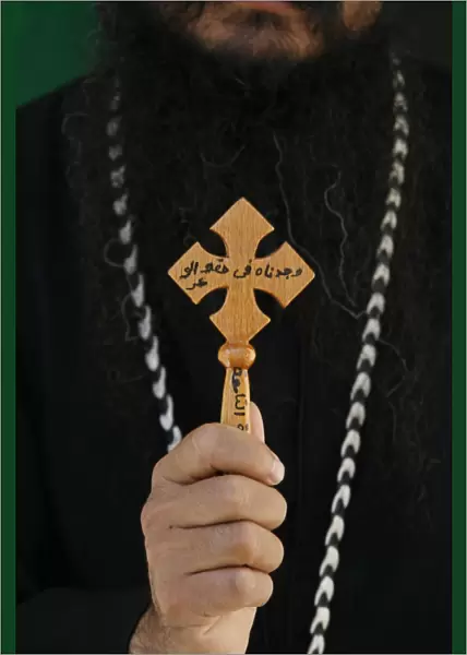 Egyptian Orthodox Coptic priest showing cross, Jerusalem, Israel, Middle East