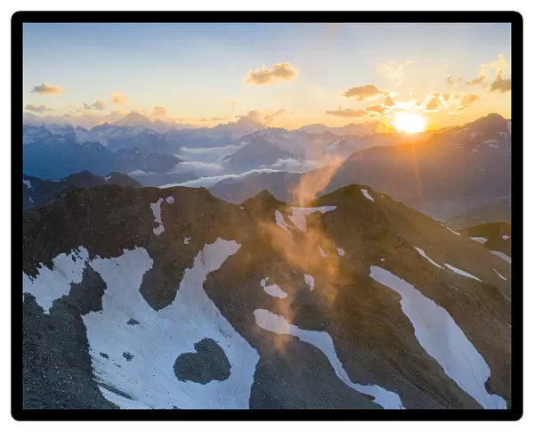 Last rays of sunset light the rocky mountain peaks, Furka Pass, Canton Uri, Switzerland