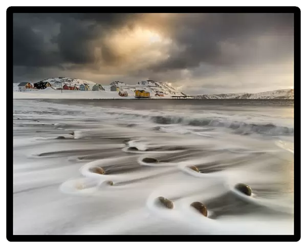 Storm clouds at dawn over waves of the Arctic icy sea, Veines, Kongsfjord