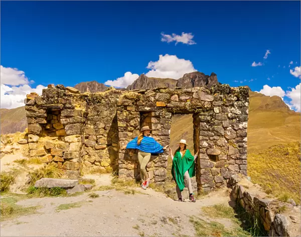 Woman exploring Inti Punku (Sun Gate), Cusco, Peru, South America