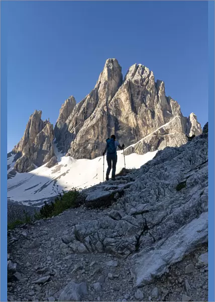 Silhouette of woman on path with Croda Dei Toni mountain in the background, Val Fiscalina