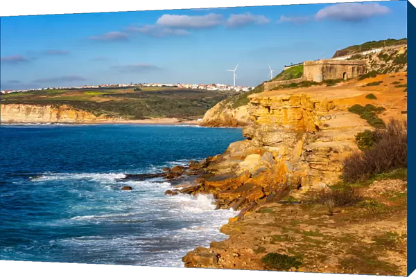Milreu fortress on the cliff and Ribeira d ilhas beach in Ericeira, Portugal, Europe