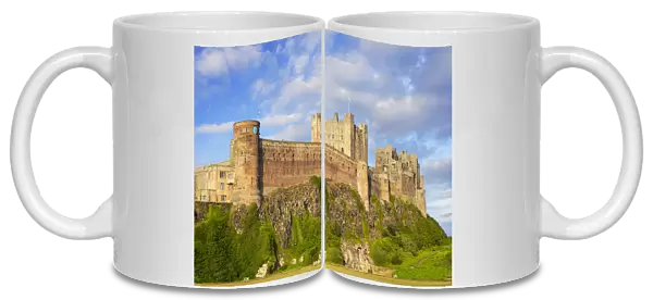Bamburgh Castle and Bamburgh Castle walls from Bamburgh Village, Northumberland, England, United Kingdom, Europe