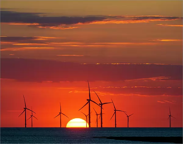 Offshore windfarm with amazing setting sun, New Brighton, Cheshire, England, United Kingdom, Europe