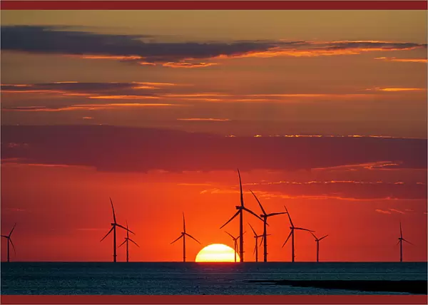 Offshore windfarm with amazing setting sun, New Brighton, Cheshire, England, United Kingdom, Europe