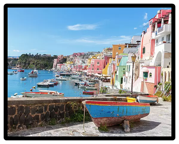 Multi-coloured houses and boats at Marina Corricella, Procida island, Naples Bay, Naples province, Phlegraean islands, Campania region, Italy, Europe