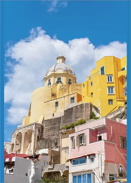 Santa Maria delle Grazie church among colourful houses in the fishing village of Marina Corricella, Procida island, Naples Bay, Phlegraean Islands, Naples province, Campania, Italy, Europe