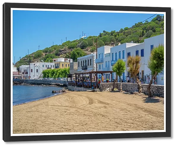 View of small beach and shops in the town of Mandraki, Mandraki, Nisyros, Dodecanese, Greek Islands, Greece, Europe