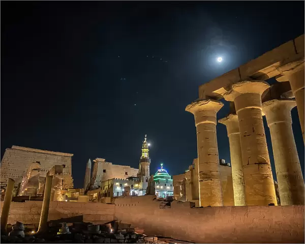The Luxor Temple at night, under a full moon, constructed approximately 1400 BCE, UNESCO World Heritage Site, Luxor, Thebes, Egypt, North Africa, Africa