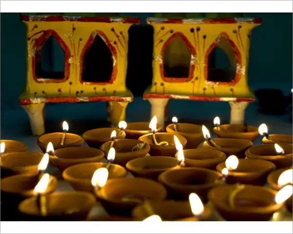 Diwali deepak lights (oil and cotton wick candles) and shrine decorations, India, Asia