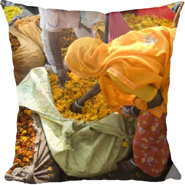 Woman buying marigolds, flower market, Bari Chaupar, Jaipur, Rajasthan, India, Asia