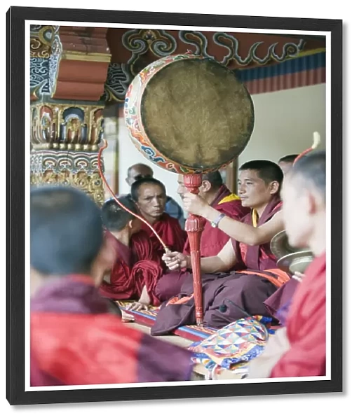 Monk with drum, Autumn Tsechu (festival) at Trashi Chhoe Dzong, Thimpu, Bhutan, Asia