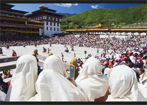 Spectators watching the Autumn Tsechu (festival) at Trashi Chhoe Dzong