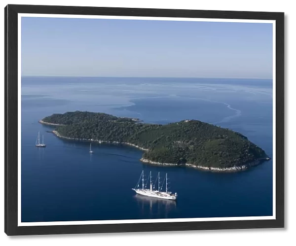 Yacht sailing round the island of Lokrum, part of the Elaphite Islands