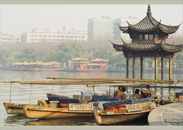 A pavillion on the waters edge of West Lake, Hangzhou, Zhejiang Province, China, Asia