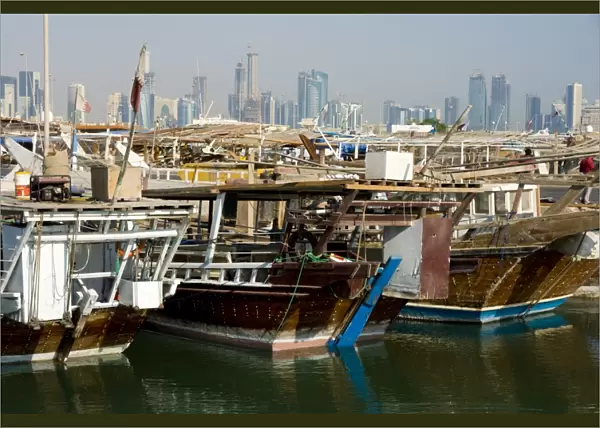 Dhows in Doha Bay and city skyline, Doha, Qatar, Middle East