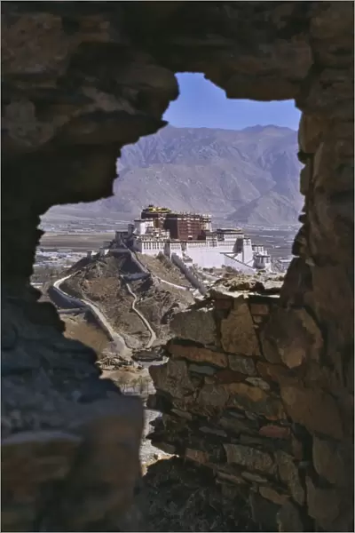 Potala Palace, UNESCO World Heritage Site, seen through ruined fort window