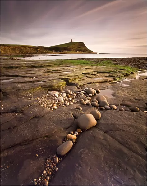 View across Kimmeridge Bay at dusk towards Hen Cliff and Clavell Tower