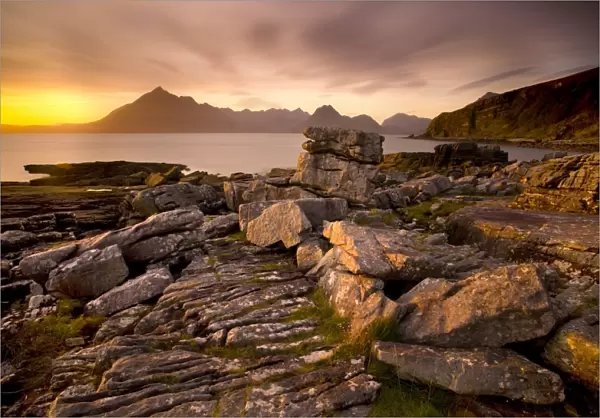 Sunset view over rocky foreshore to the Cuillin Hills from Elgol, Isle of Skye