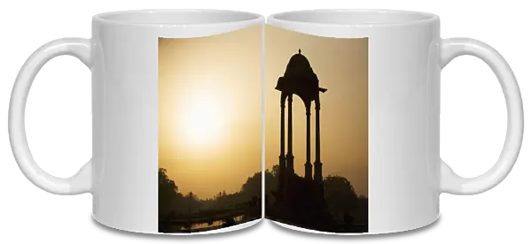 Sunrise silhouettes a chhattri in New Delhi, India, Asia