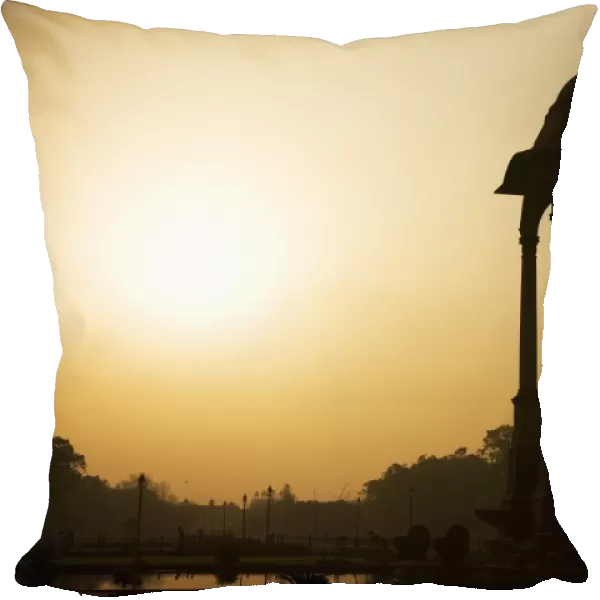 Sunrise silhouettes a chhattri in New Delhi, India, Asia