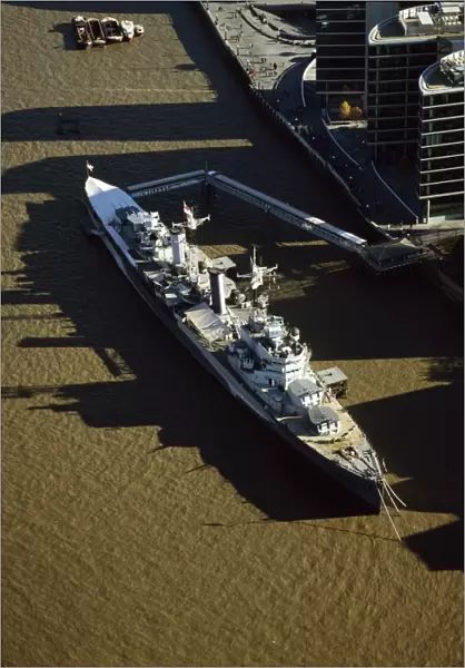 Aerial image of HMS Belfast, a Royal Navy Town-class cruiser, on the River Thames