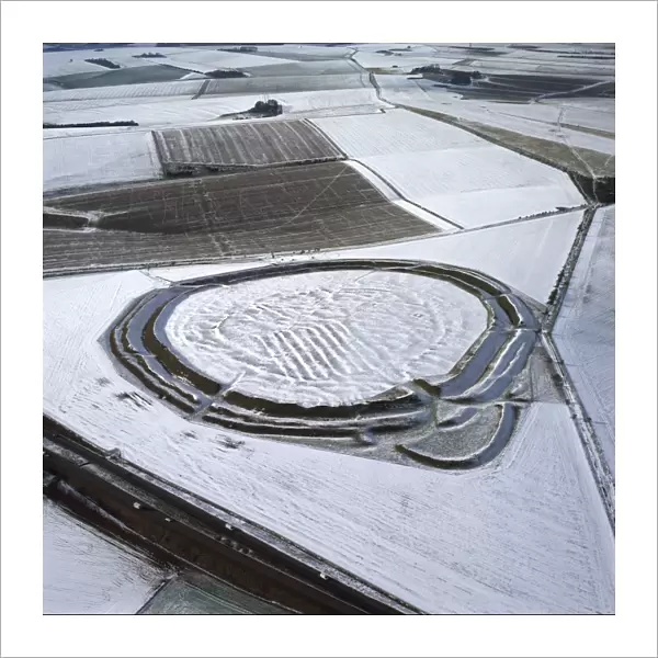 Aerial image of Yarnbury Castle, a hill fort, in snow, Wiltshire, England