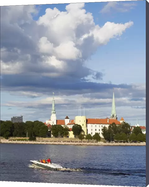 Speedboat on Daugava River with Riga Castle in background, Riga, Latvia