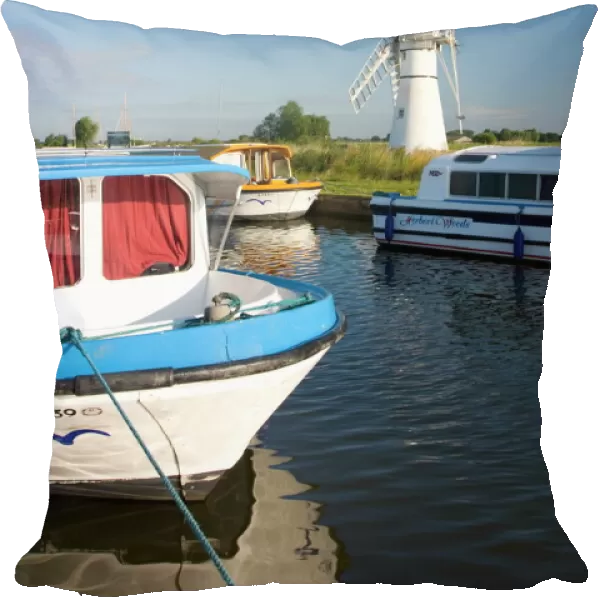 Pleasure boats moored beside Thurne windmill, Norfolk Broads, Thurne, Norfolk
