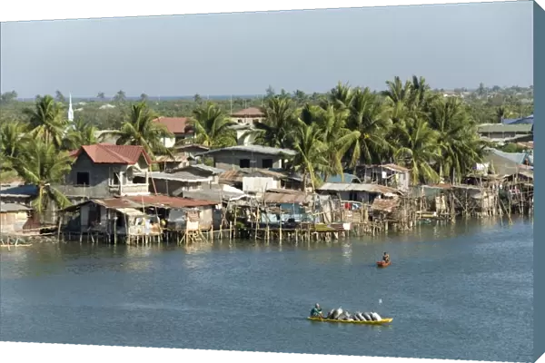Fishermens stilt houses in wetlands at south end of Lingayen Gulf