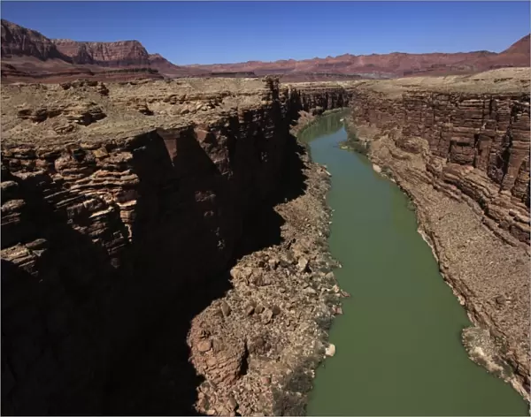 The Colorado River winds through the sheer cliffs of Marble Canyon, south of the Grand Canyon