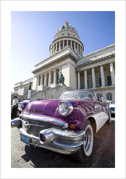 Restored classic American car parked outside The Capitilio, Havana, Cuba