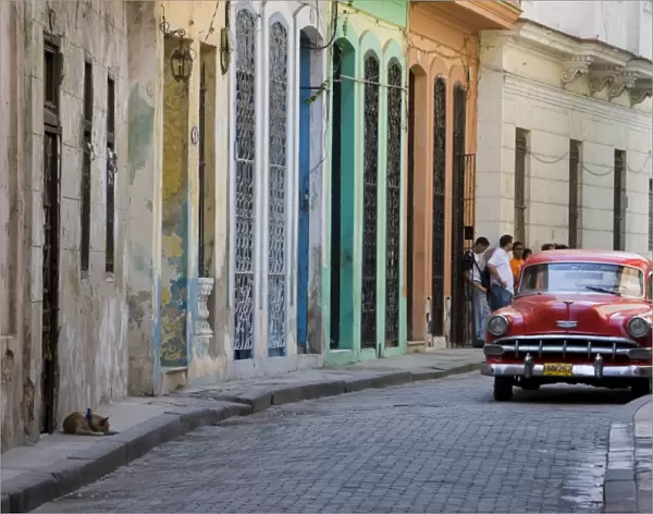 Colourful street with traditional old American car parked, Old Havana, Cuba