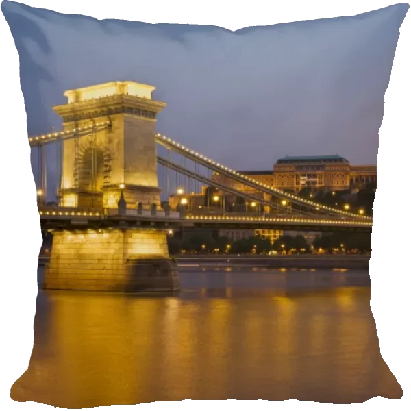 The Chain Bridge (Szechenyi Lanchid), over the River Danube, illuminated at sunset with the Hungarian National Gallery behind, UNESCO World Heritage Site, Budapest