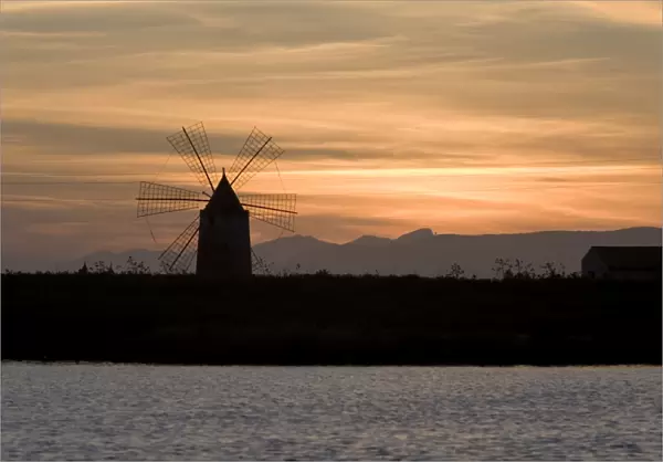 Sunset over windmill on salt beds, Trapani, Sicily, Italy, Mediterranean, Europe