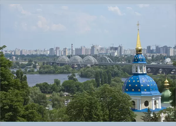 View of Vydubychi Monastery, looking over the Dnipro River to the residential area of Berezniaky, Kiev, Ukraine, Europe