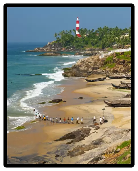 View to the Lighthouse with fishermen, Kovalam, Kerala, India, Asia
