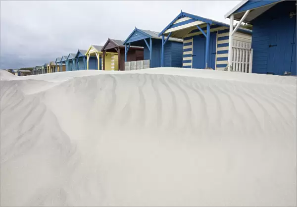 Beach huts in sand drift, West Wittering, West Sussex, England, United Kingdom, Europe