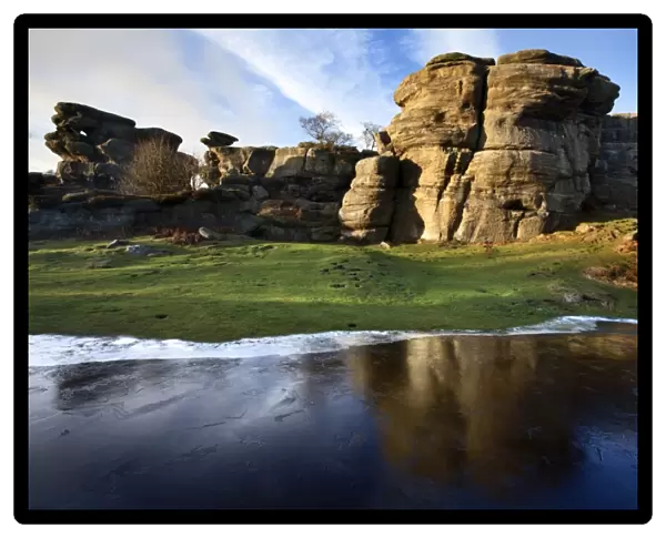 Gritstone formations at Brimham Rocks reflected in frozen flood water Summerbridge, North Yorkshire, Yorkshire, England, United Kingdom, Europe