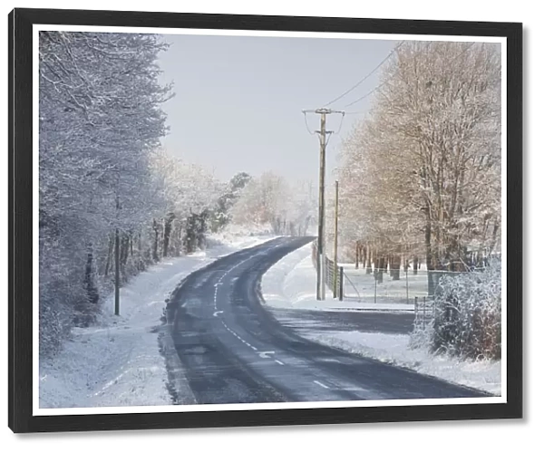 A snow covered road near to Villefranche-sur-Cher, Loir-et-Cher, Centre, France, Europe